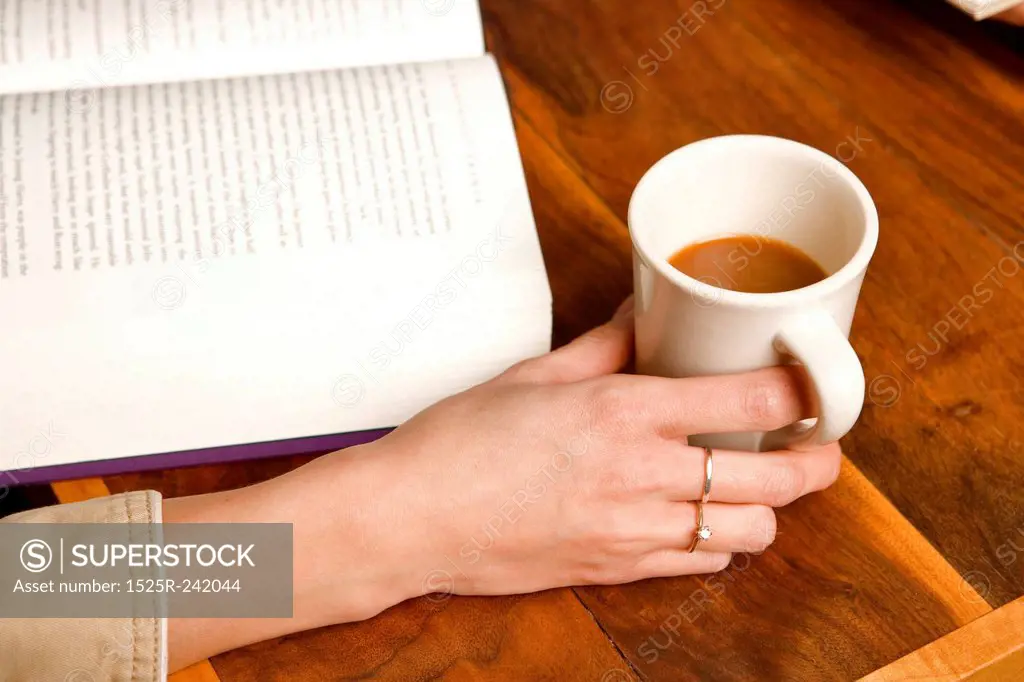 Woman Drinking Coffee and Studying