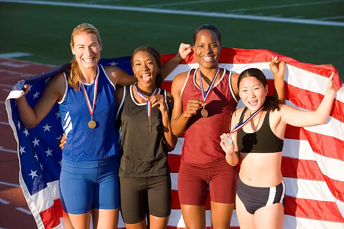 Team of American female athletes celebrating victory