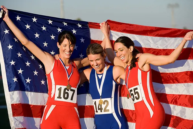 Team of American female athletes celebrating victory