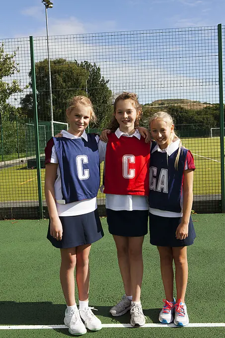 Portrait of schoolgirl netball players