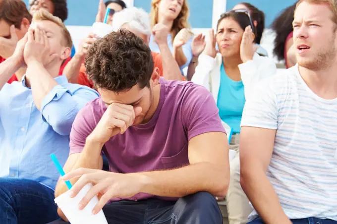 Disappointed Spectators At Outdoor Sports Event