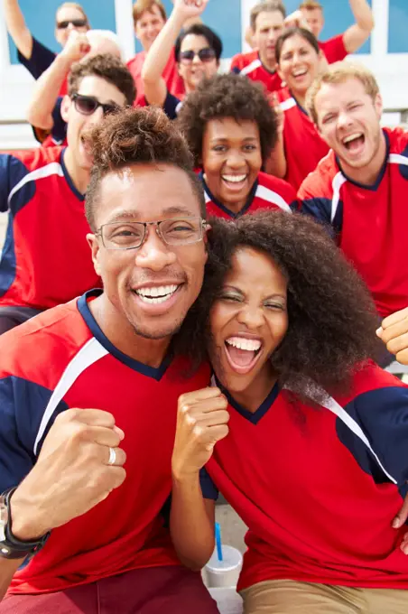 Spectators In Team Colors Watching Sports Event