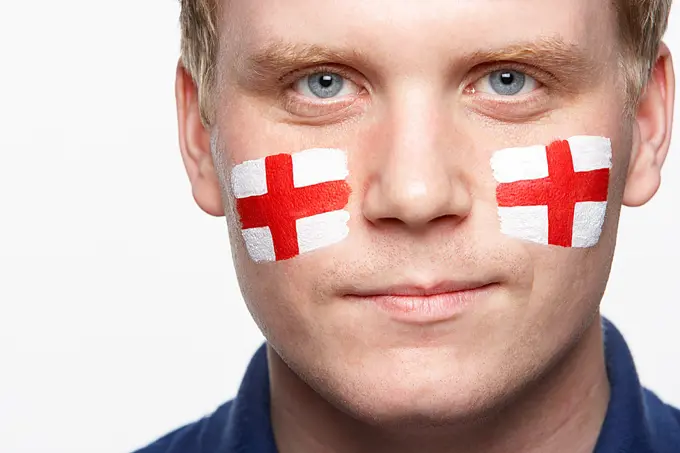 Young Male Sports Fan With St Georges Flag Painted On Face