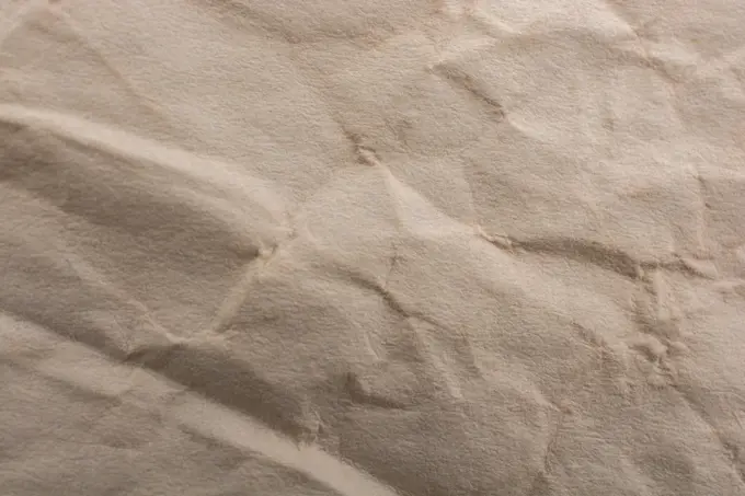 Brown color wrinkled paper as a background