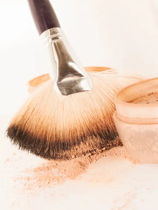 set of face powder with brush. close up