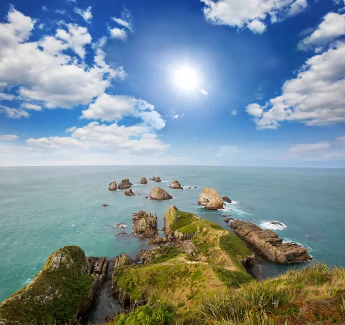 Beautiful Sunset at the Ocean Beach, New Zealand. Inspiring natural and travel background