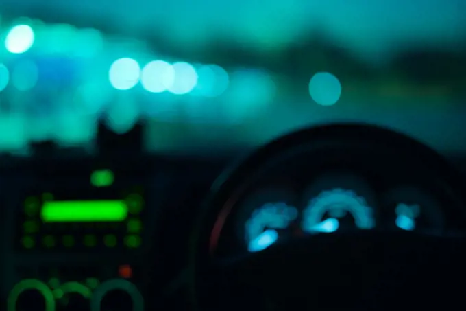 Night road view from inside car natural light blue color blurred