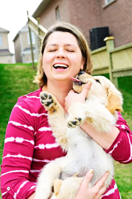 Woman holding puppy