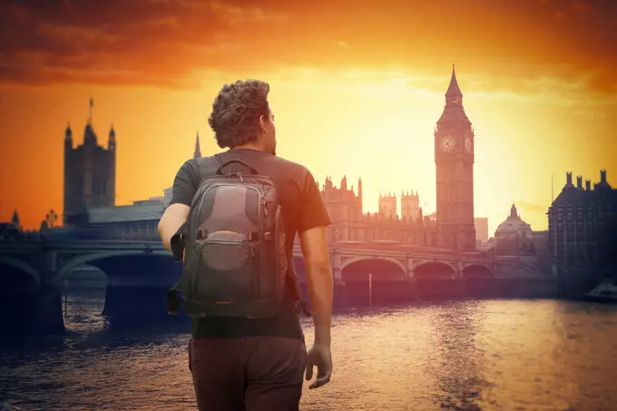 A traveler with a backpack. Big Ben at sunset.  London, England. A traveler with a backpack. Big Ben 