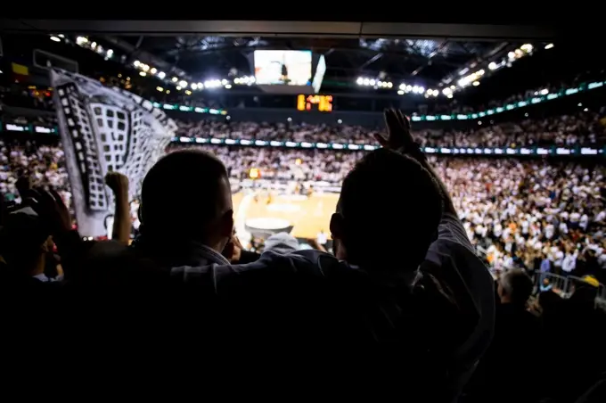 supporters cheering during a basketball game