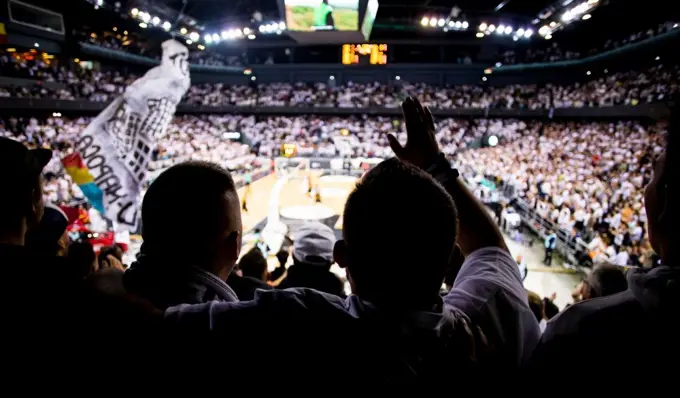 supporters cheering during a basketball game