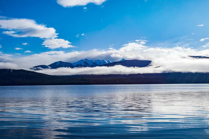 beautiful scenic of blue sky white cloud of lake te anau most popular traveling destination in new zealand