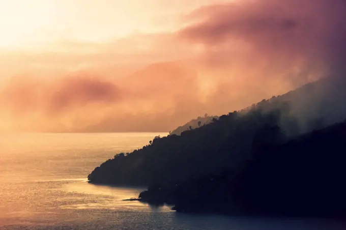 Beautiful Sunset at the Ocean Beach, New Zealand. Inspiring natural and travel background