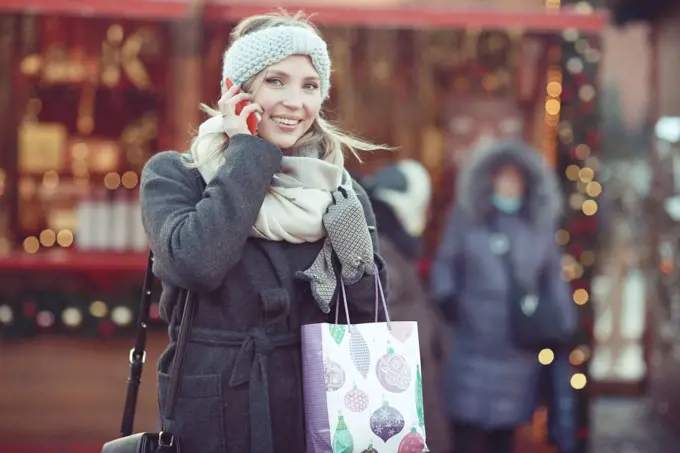 happy woman buys gifts for the new year