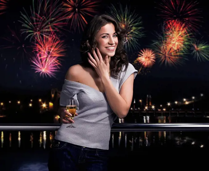 Beautiful brunette on a fireworks background