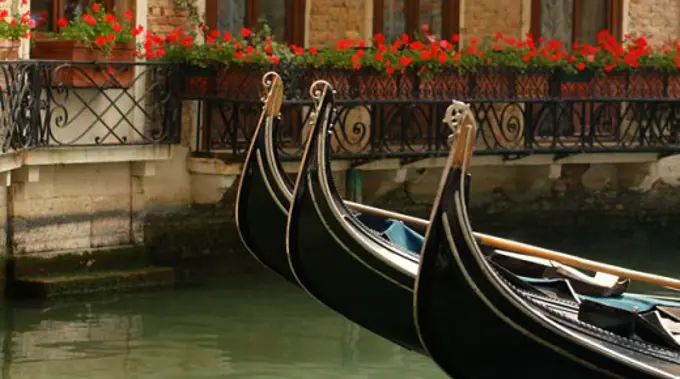 Residential scene of gondolas in a side street canal in Venice Italy Europe