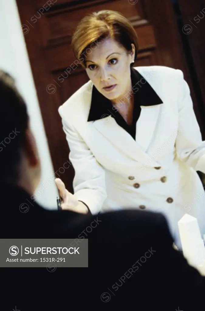 Businesswoman talking to a businessman in anger