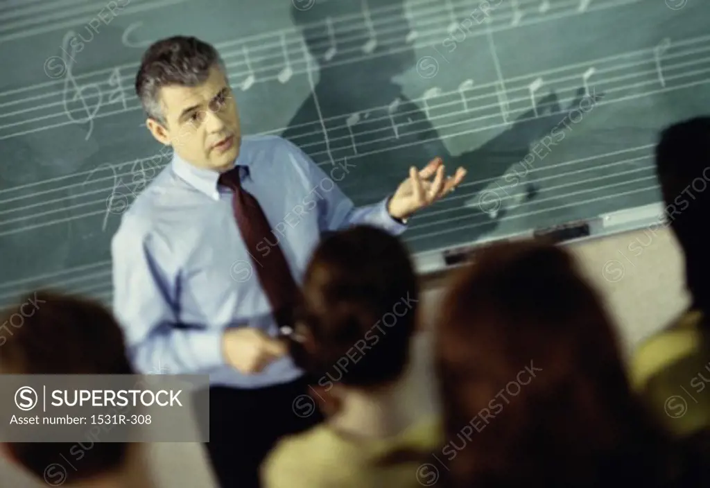 Male music teacher in a classroom