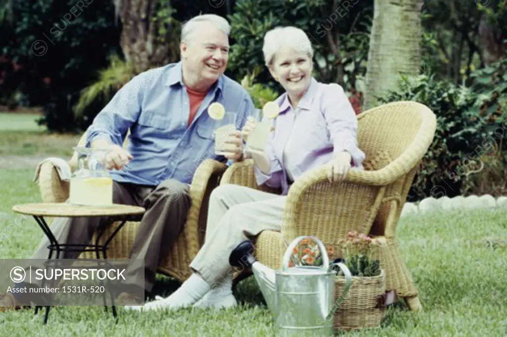 Senior couple sitting together outdoors