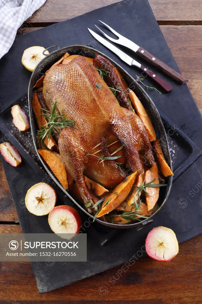 Roast duck with sweet potatoes and apple