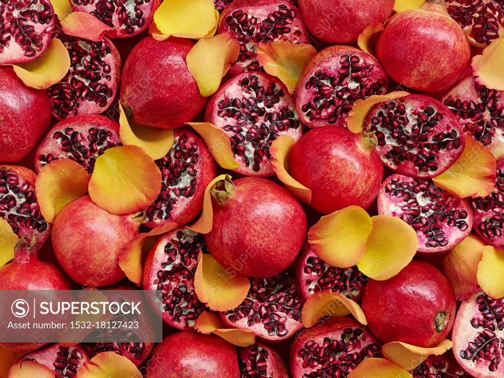 Pomegranates and yellow rose petals (whole image)