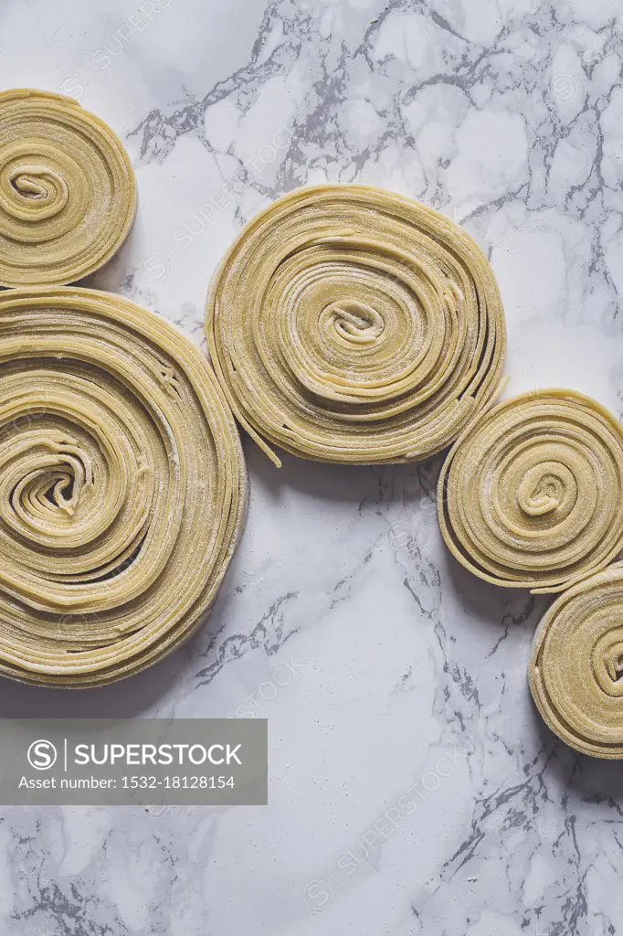 Fresh uncooked pasta swirls