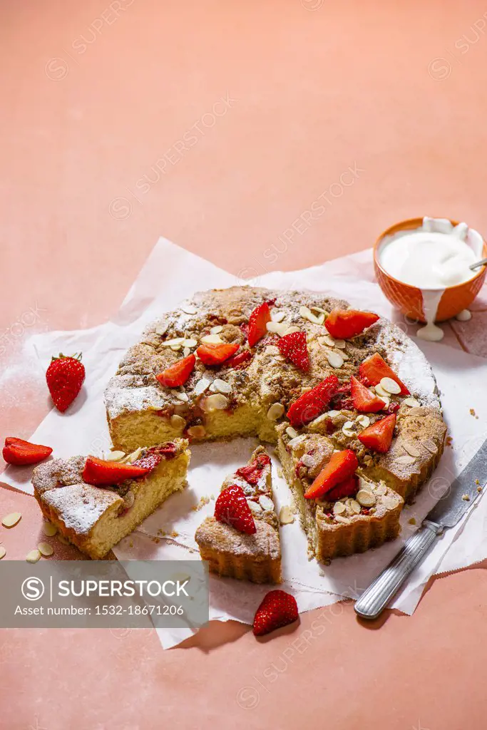 Almond sponge with strawberries and crumble topping