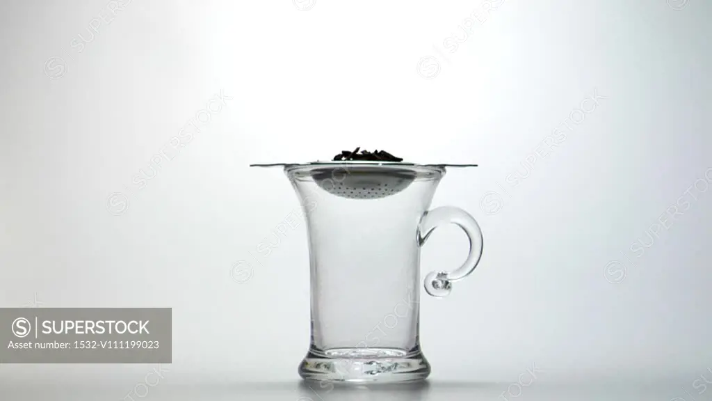 Photograph Of Hot Water Pouring Into Glass Tea Cup With Isolated On White  Stock Photo, Picture and Royalty Free Image. Image 27363242.