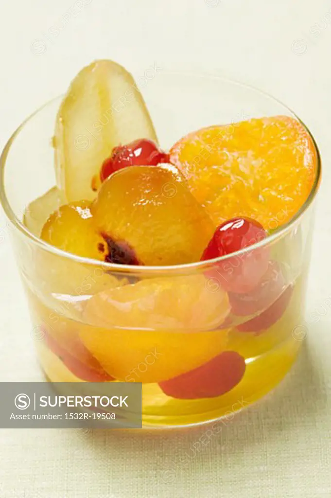 Candied fruit with mustard in glass