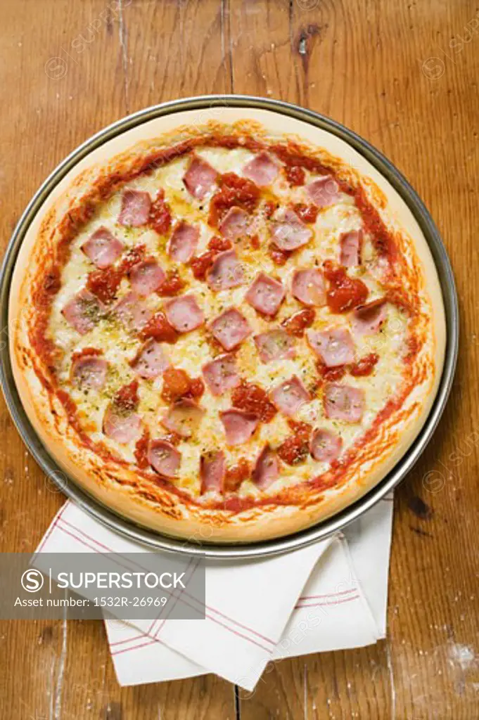 Ham, cheese and tomato pizza