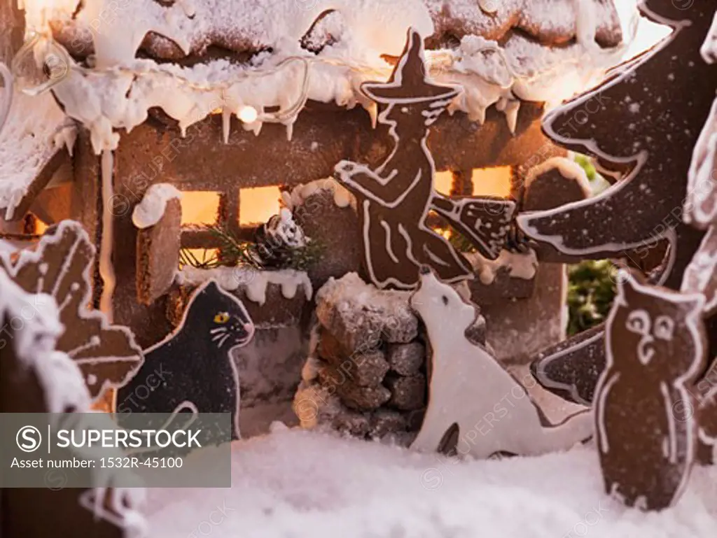 Gingerbread house with gingerbread animals and witch