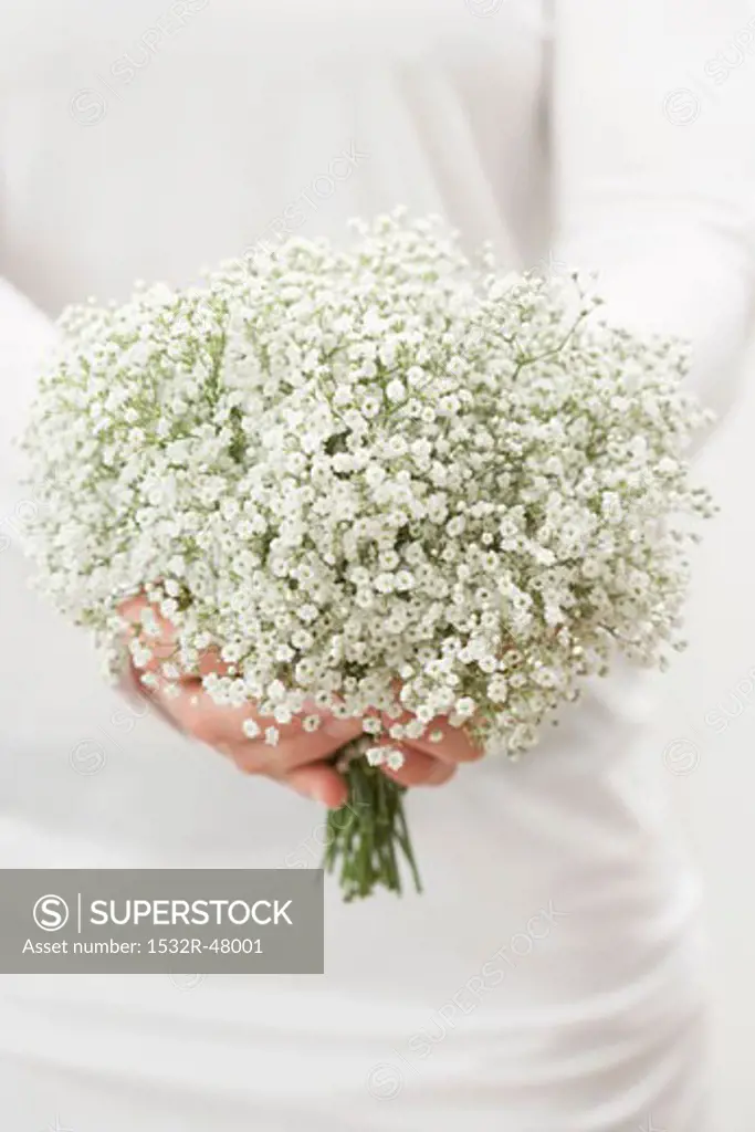 Woman holding a bouquet of gypsophila