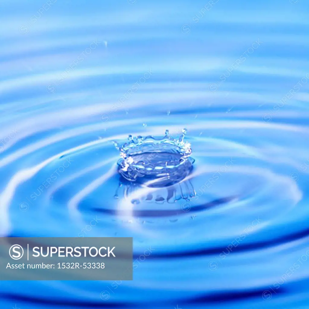 Splash caused by a drop of water falling into water