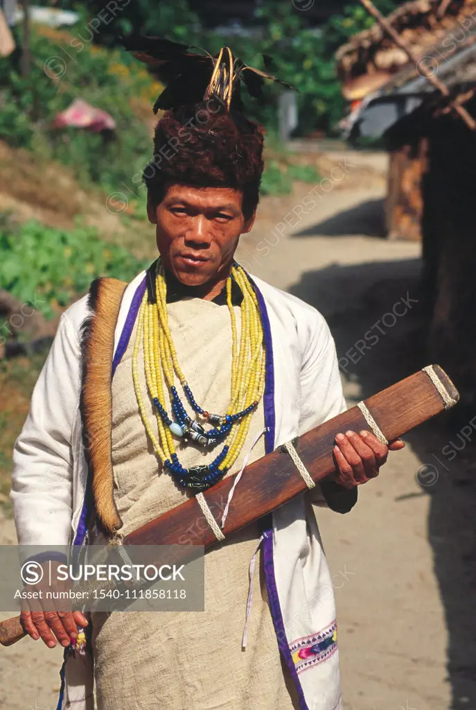 Dao - large knife in man's hands , 'Miji' tribe man with traditional dress , Arunachal Pradesh , India