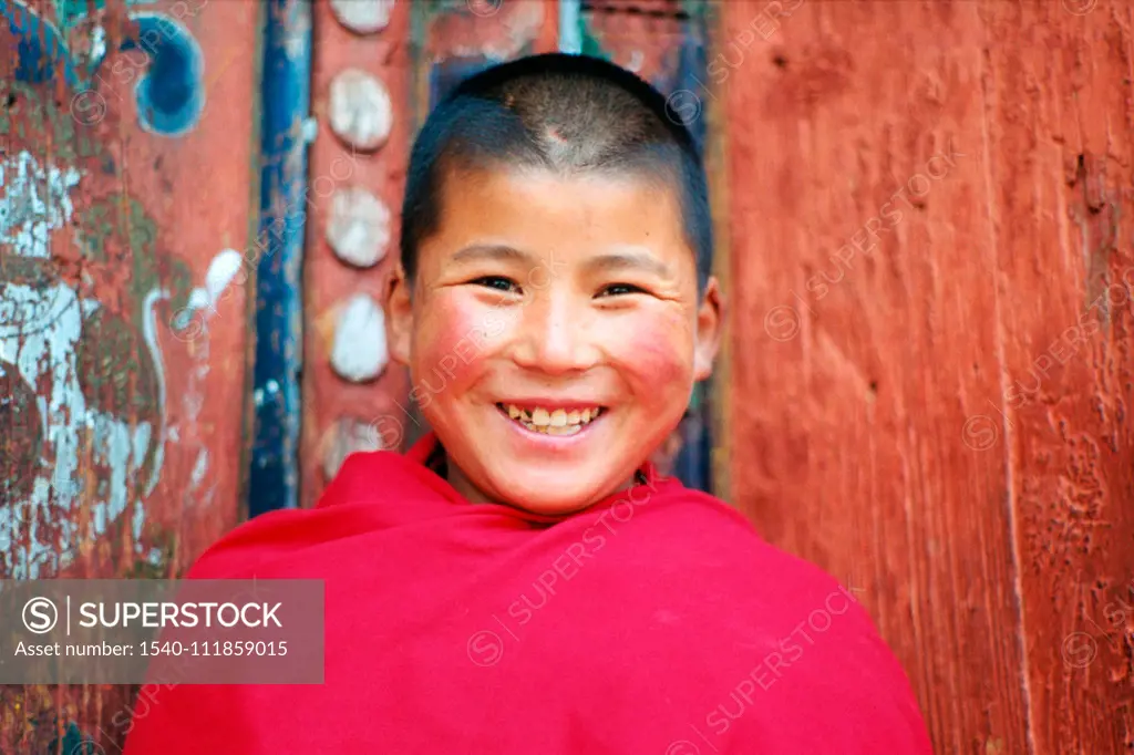 Young Monk looking to the camera with smile