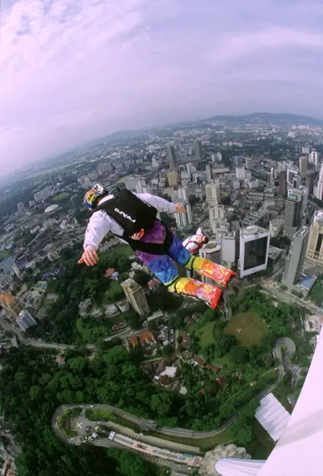 Person base jumping, KL Tower, Kuala Lumpur, Malaysia (fish-eye lens)