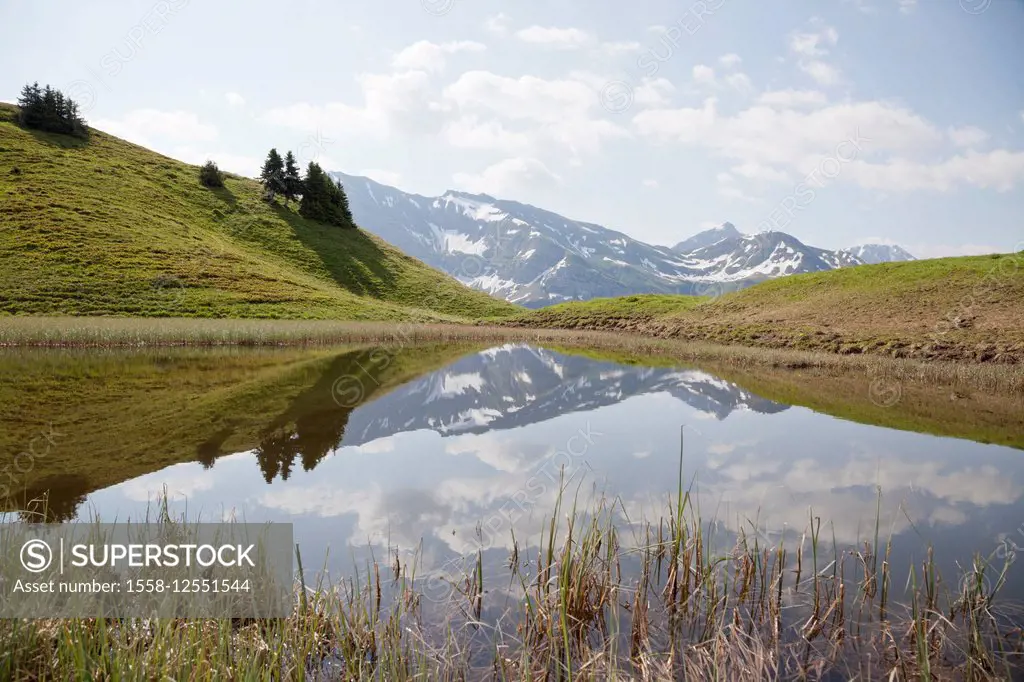 Reflection of a mountain range in a mountain lake, Austria, Vorarlberg, Warth, tub lake