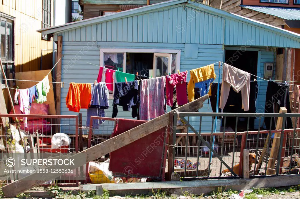 Clothesline in front of little house in Castro, Chile