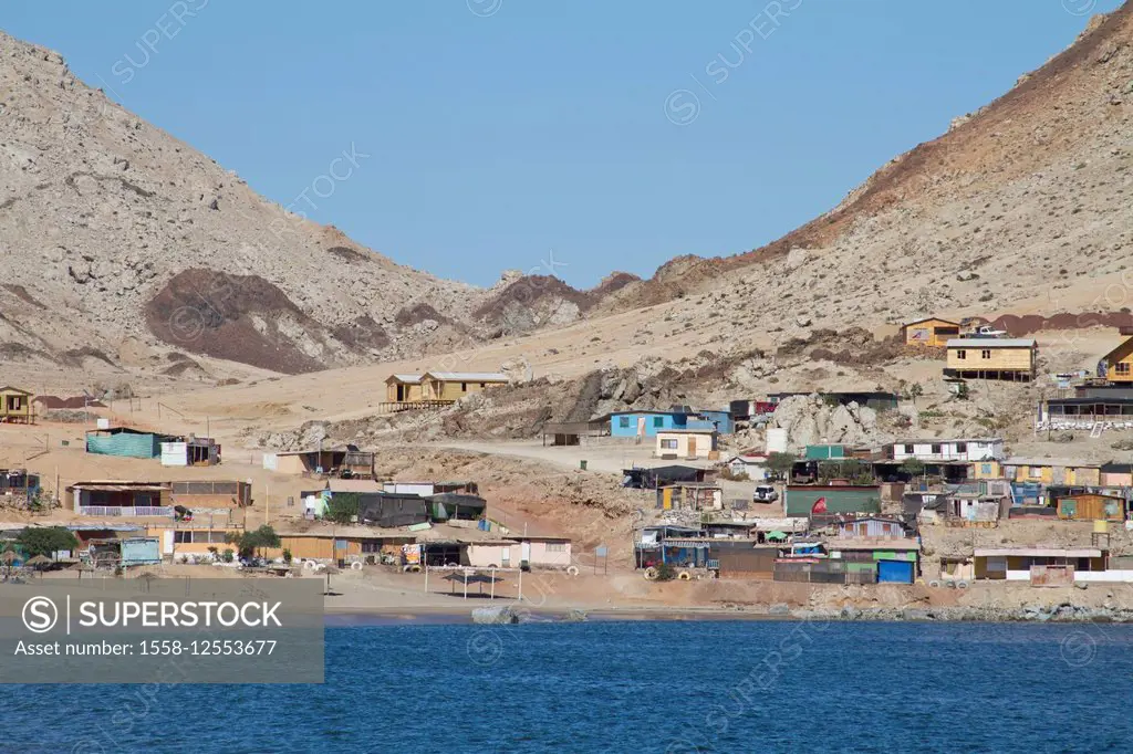 coloured houses of a fishing village at the Atlantic coast, Northern Chile