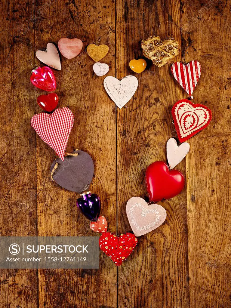 Red metal and textile hearts on a heart-shaped table