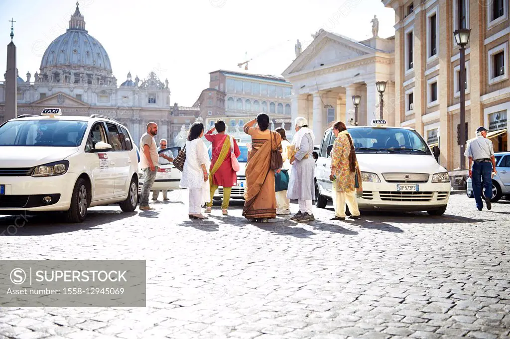 Indian tourists in front of St. Peter's Basilica, Vatican, Italy