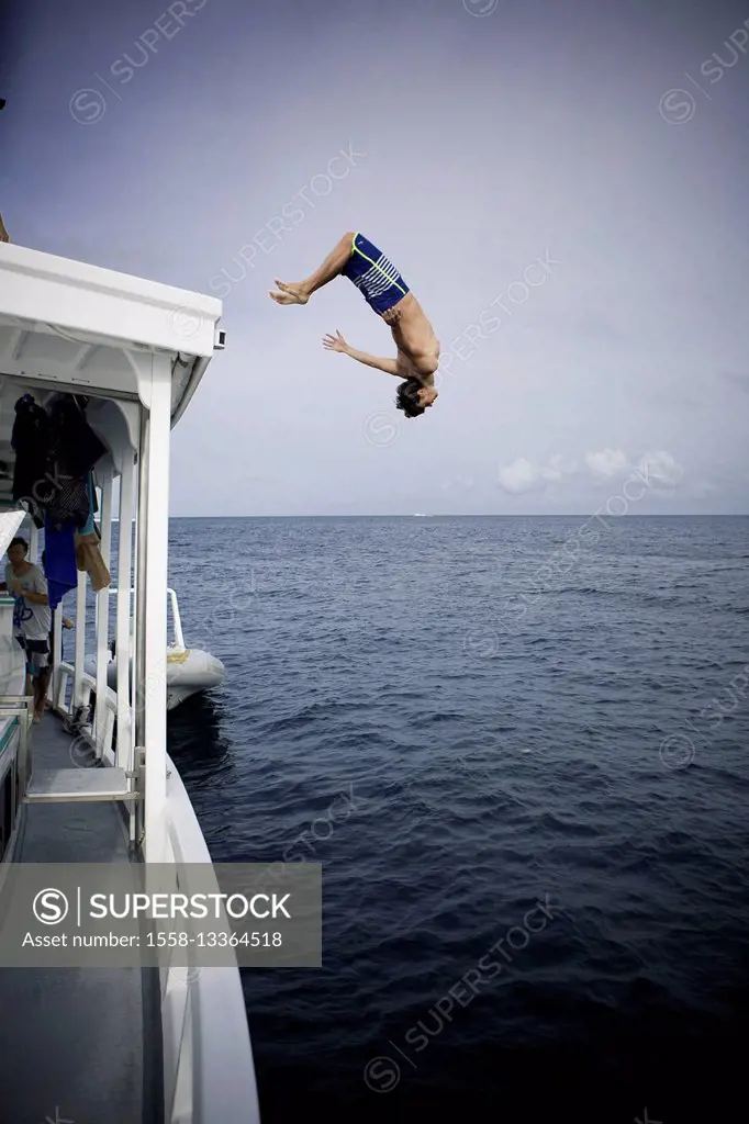 young man, backflip from the boat