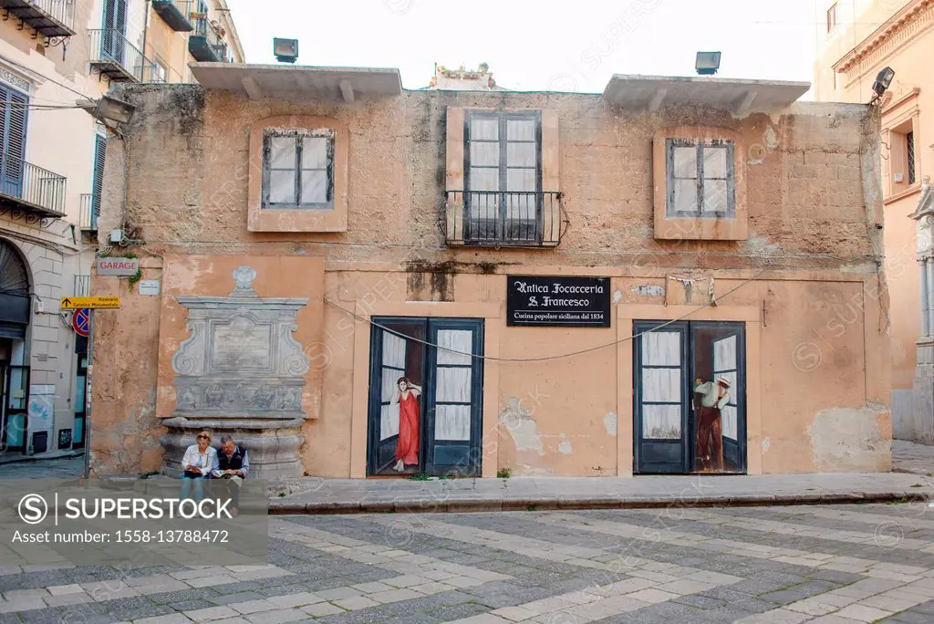 Two tourists in the Old Town of Palermo, Sicily