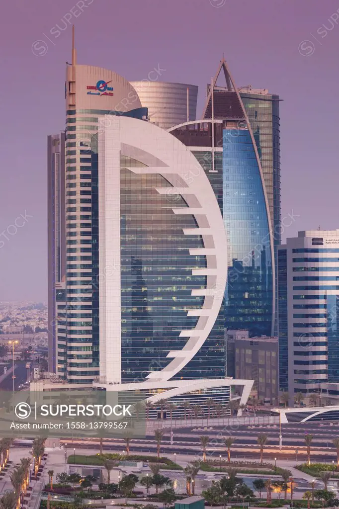 Qatar, Doha, Doha Bay, West Bay skyscrapers, Doha Bank Tower, dusk