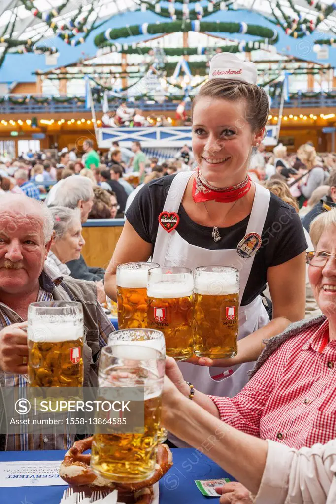 Germany, Bavaria, Munich, Oktoberfest, Waitress at Table