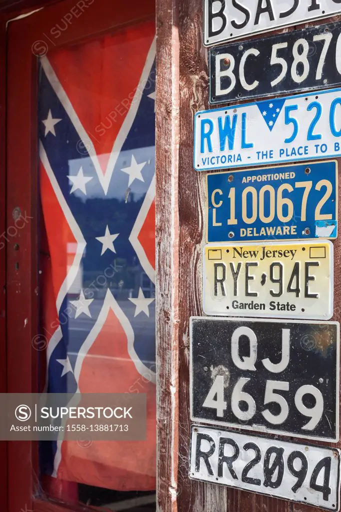 New Zealand, South Island, West Coast, Ross, USA license plates and US Confederate Rebel flag