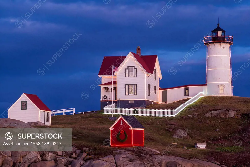 USA, Maine, York Beach, Nubble Light Lighthouse with Christmas decorations, dusk