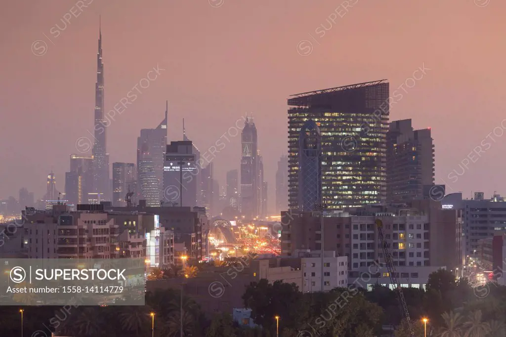 UAE, Dubai, Deira, view of Downtown Dubai Skyscrapers from Dubai Creek, dusk