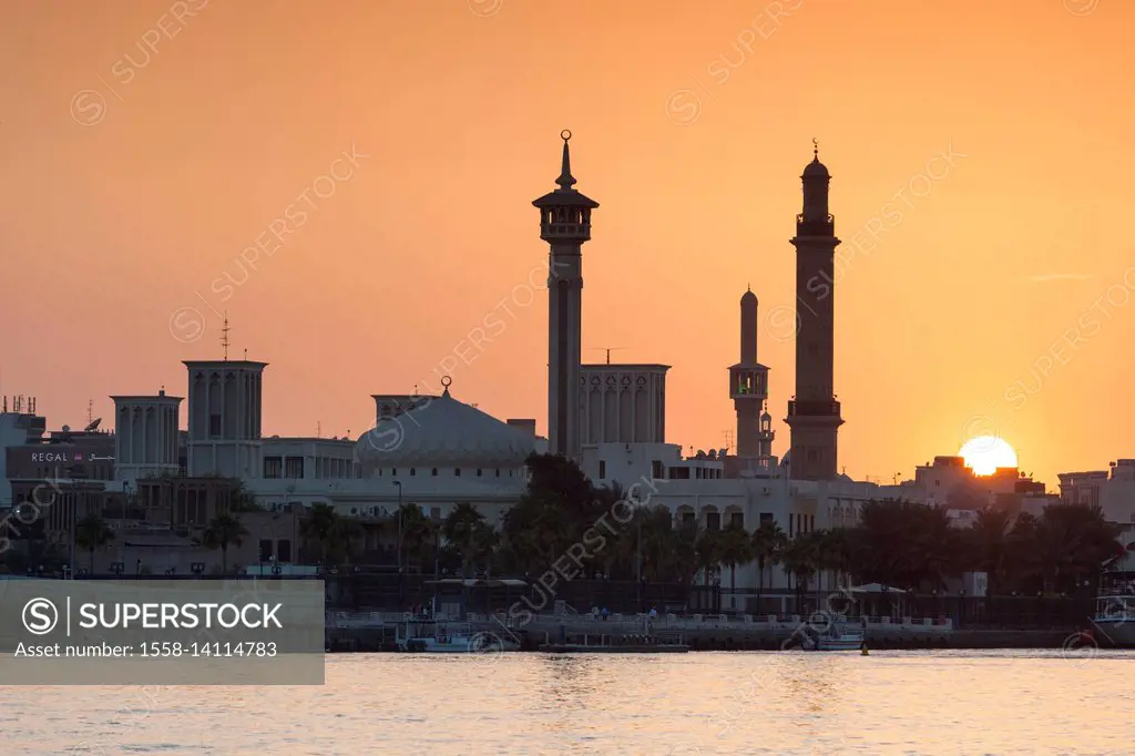 UAE, Dubai, Bur Dubai, sunset over The Rulers Court from Dubai Creek