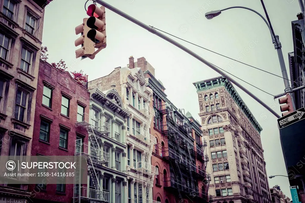 Streetscape of Broome Street, historic buildings, houses with fire stairs, typical architecture in Little Italy, Manhatten, New York, USA